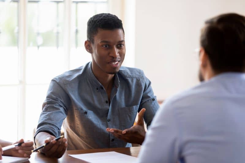 Two business professionals having a discussion.