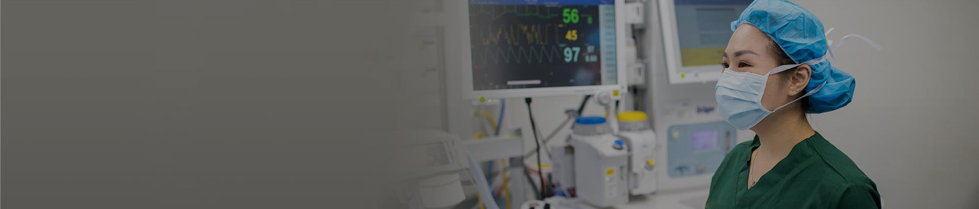 Surgical nurse looking at medical equipment